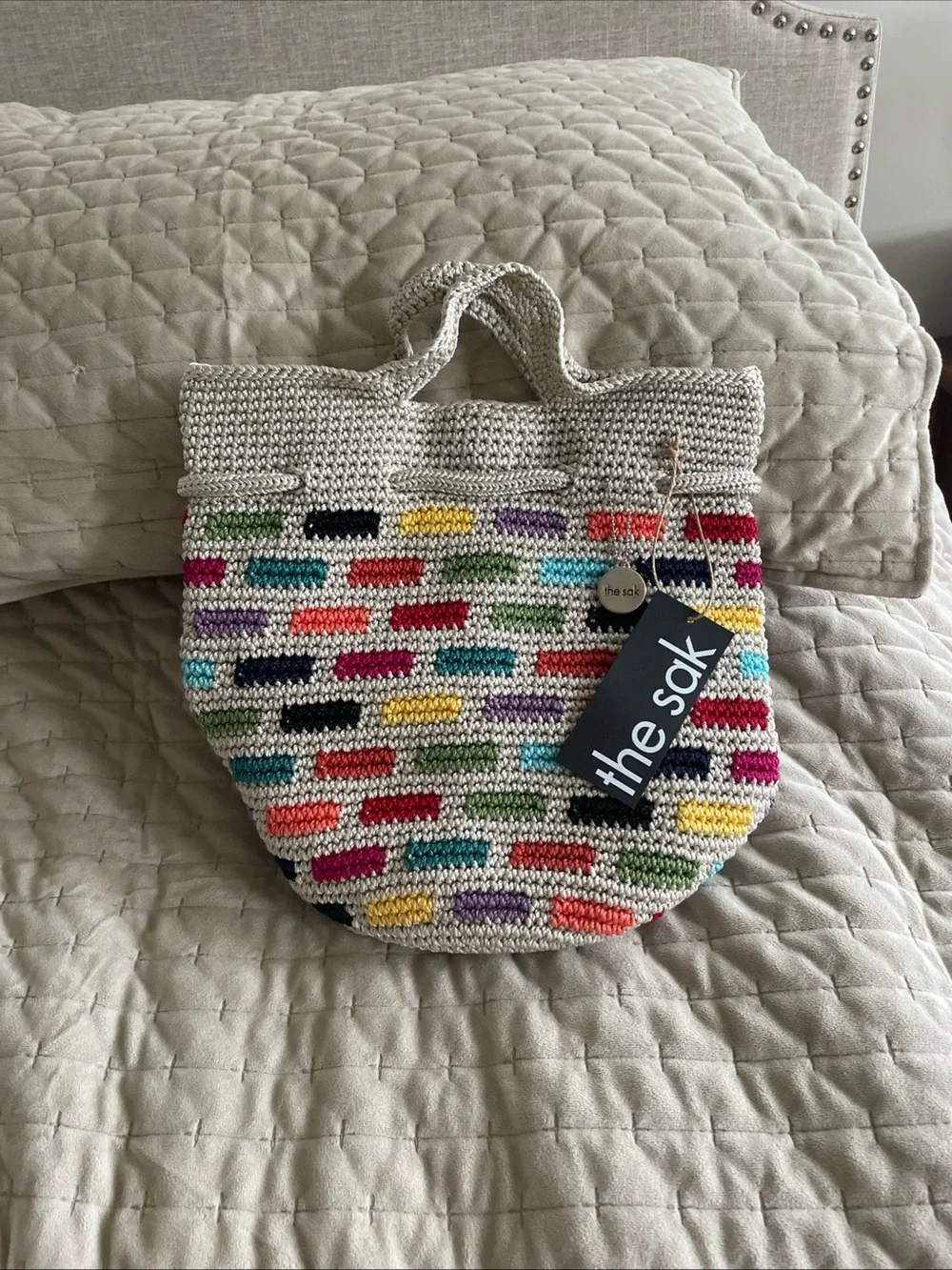 The Sak Cream Crochet Tote backpack with Multicolor Accent Bricks
